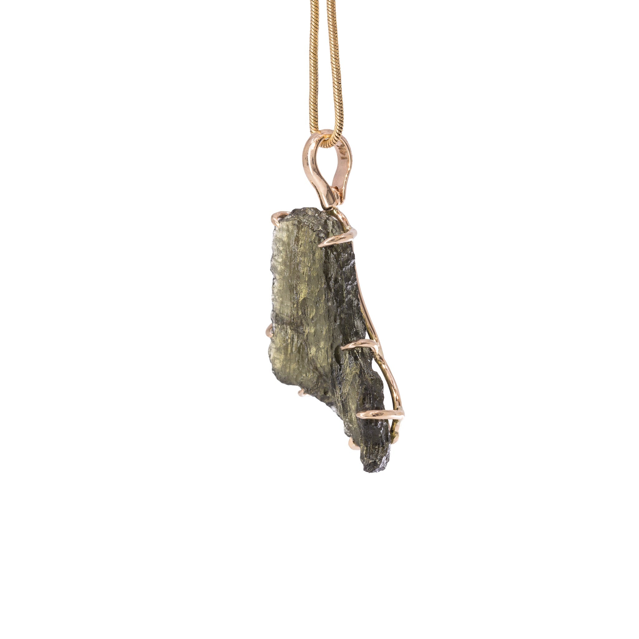 Side view of raw Moldavite crystal pendant with 14K gold prong setting