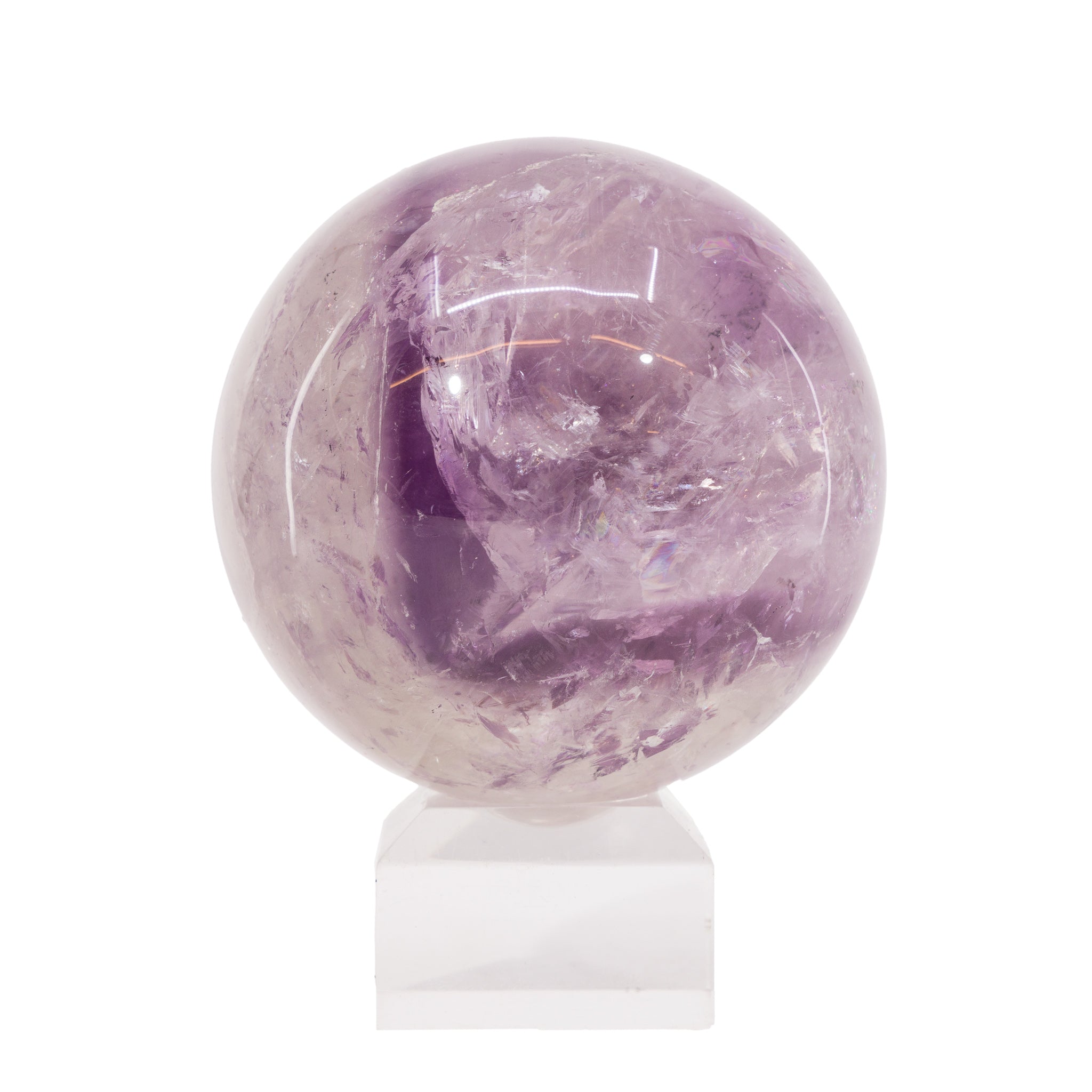 Amethyst crystal sphere on a white stand with a white background