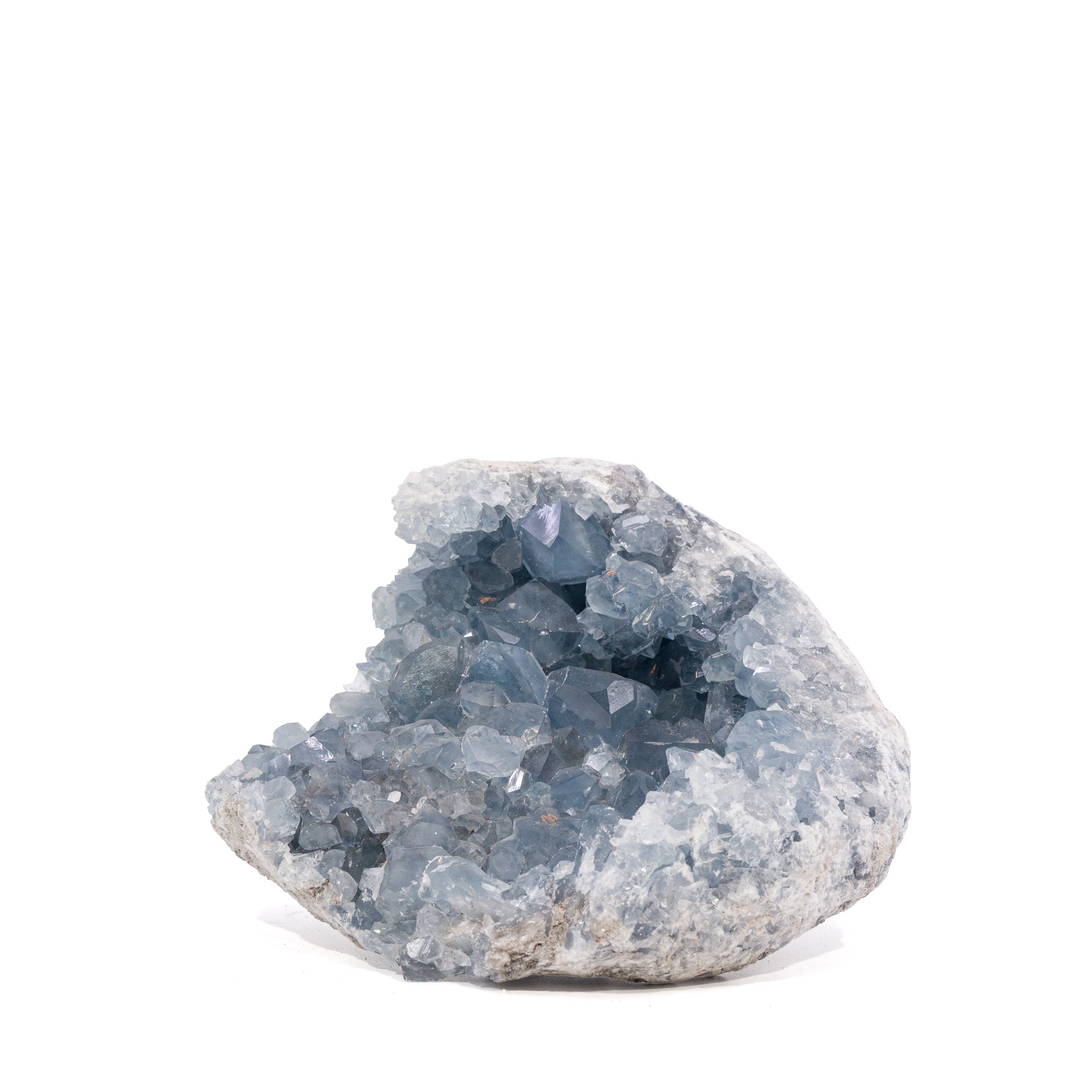 Front view of open Madagascar Celestite geode densely lined with blue-gray crystals