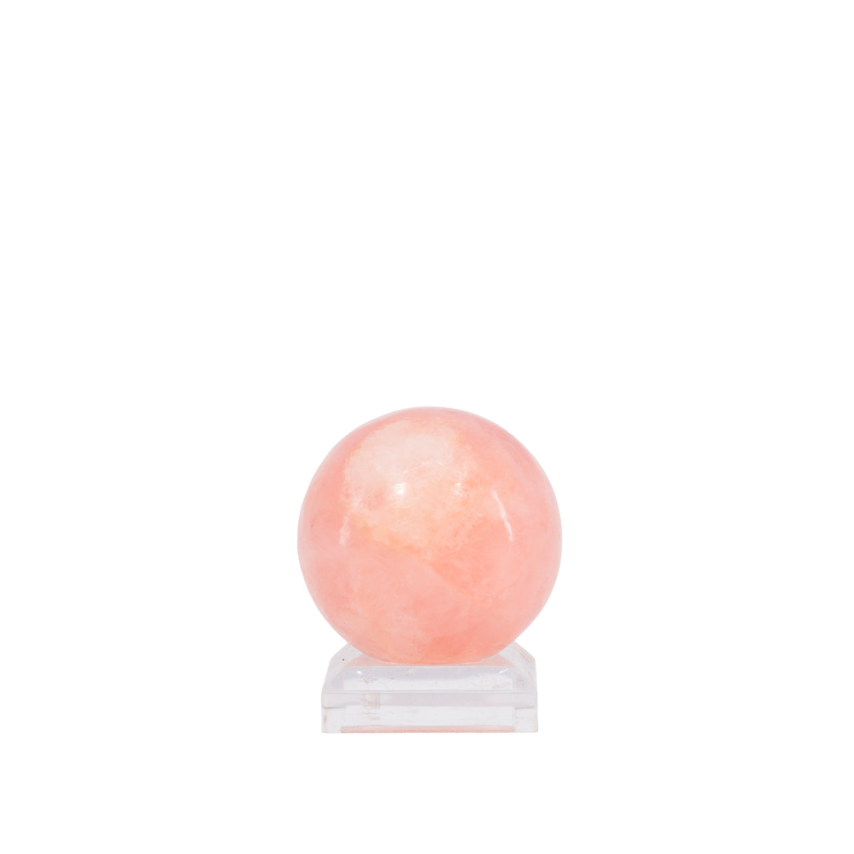 Morganite sphere showing pale peach and cloudy translucent areas