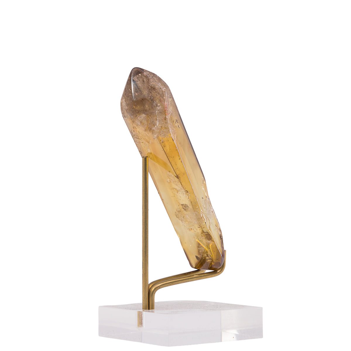 Angled view of polished Citrine point and natural inclusions