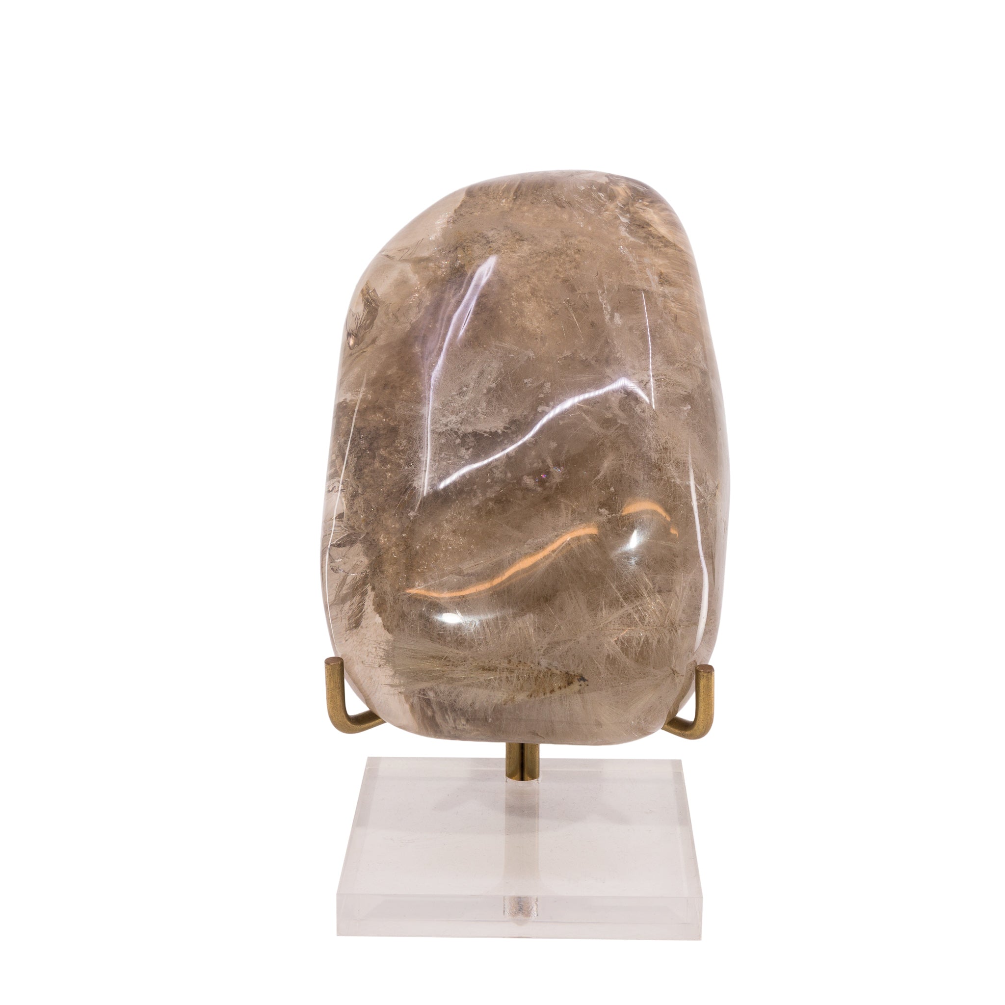 Front view of large smoky Rutilated Quartz freeform displayed upright on a stand