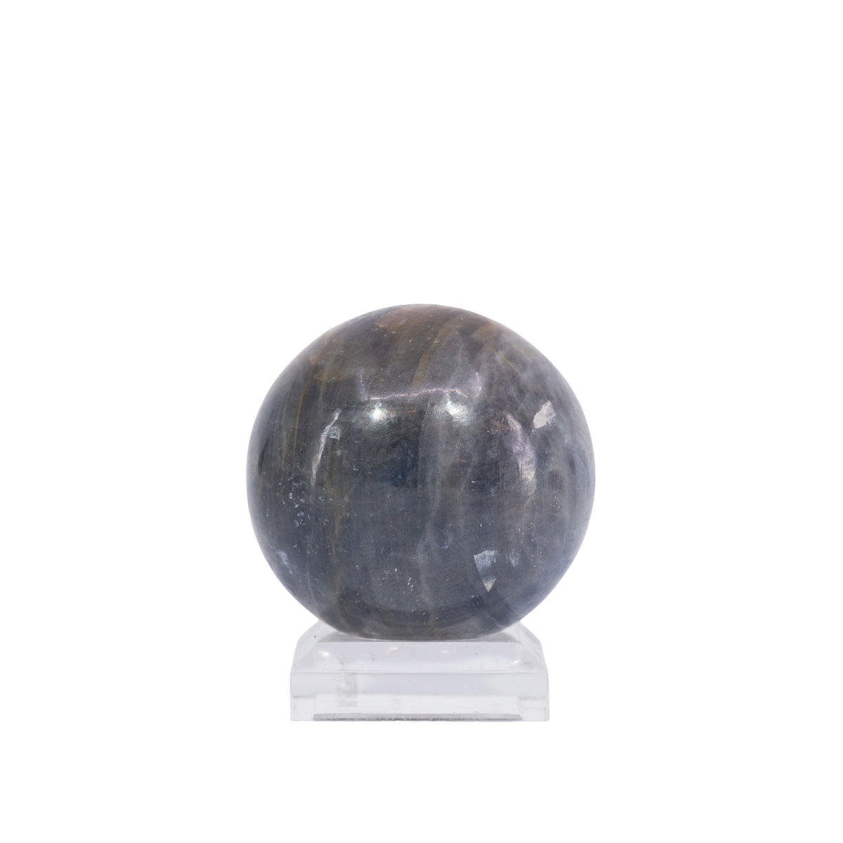 Sapphire sphere showing smoky translucence and pale mineral banding