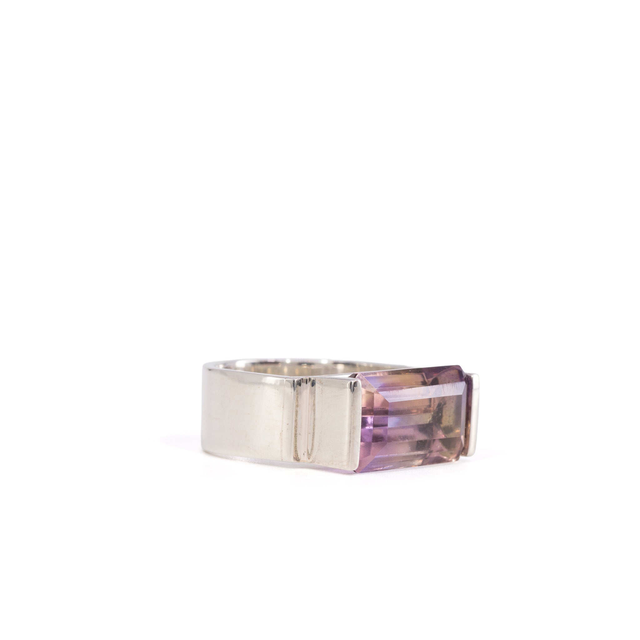 Three-quarter view of Ametrine ring showing violet and golden color zoning