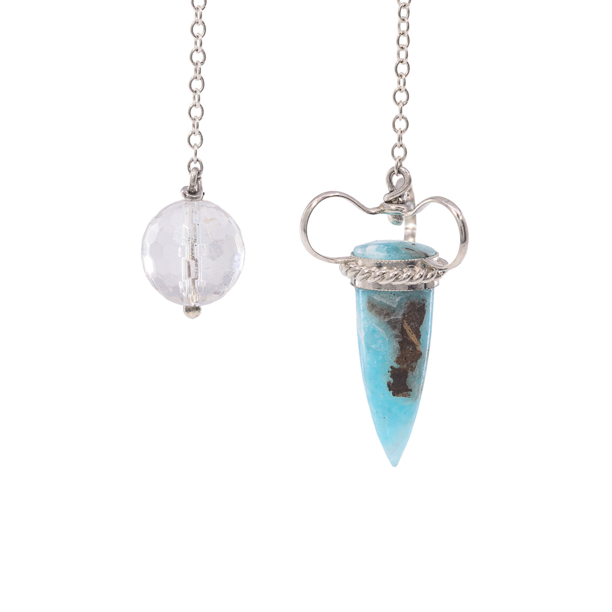 Front view of sky-blue Hemimorphite point in sculptural silver setting
