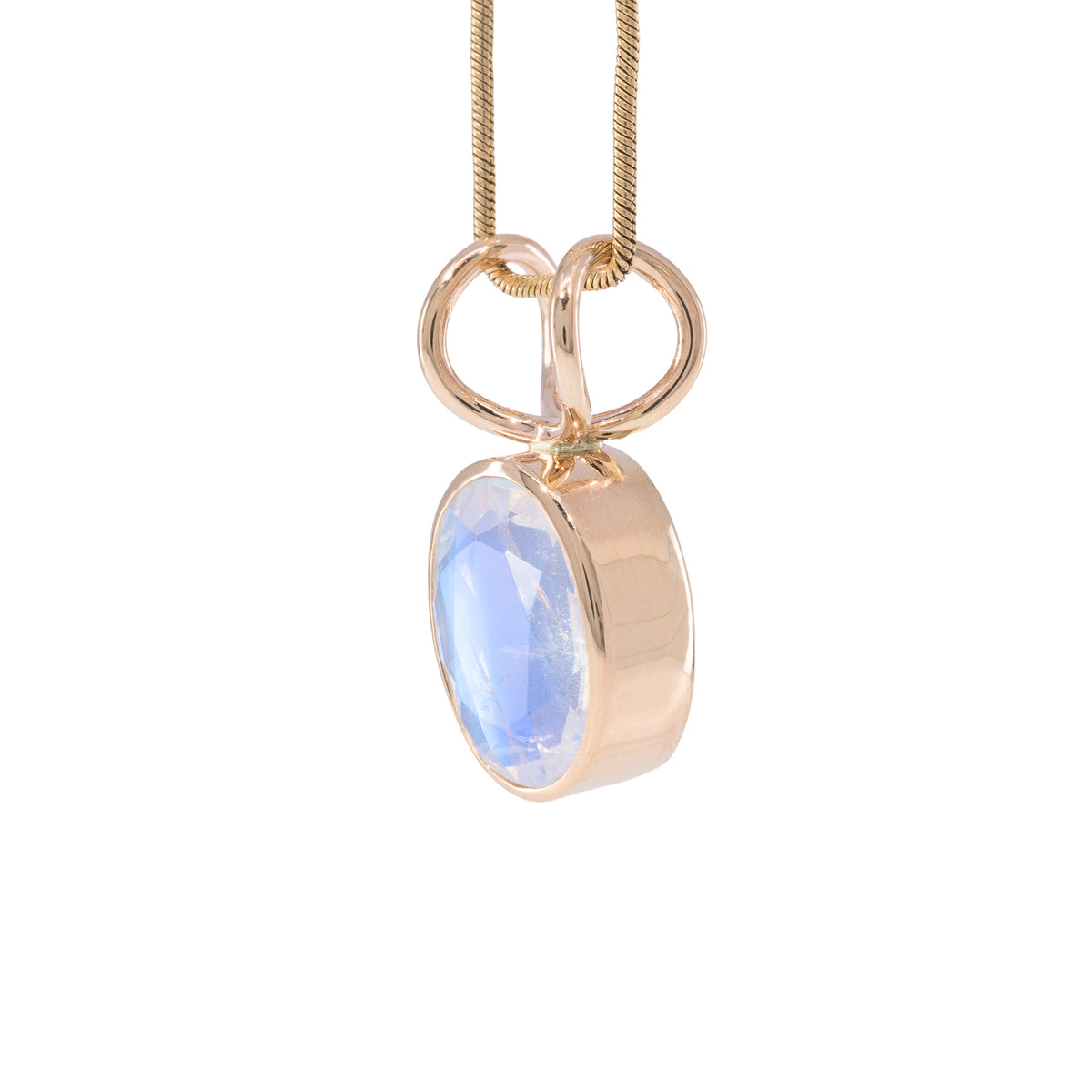 Angled view of 14K Moonstone charm pendant showing the substantial bezel and double-loop bail