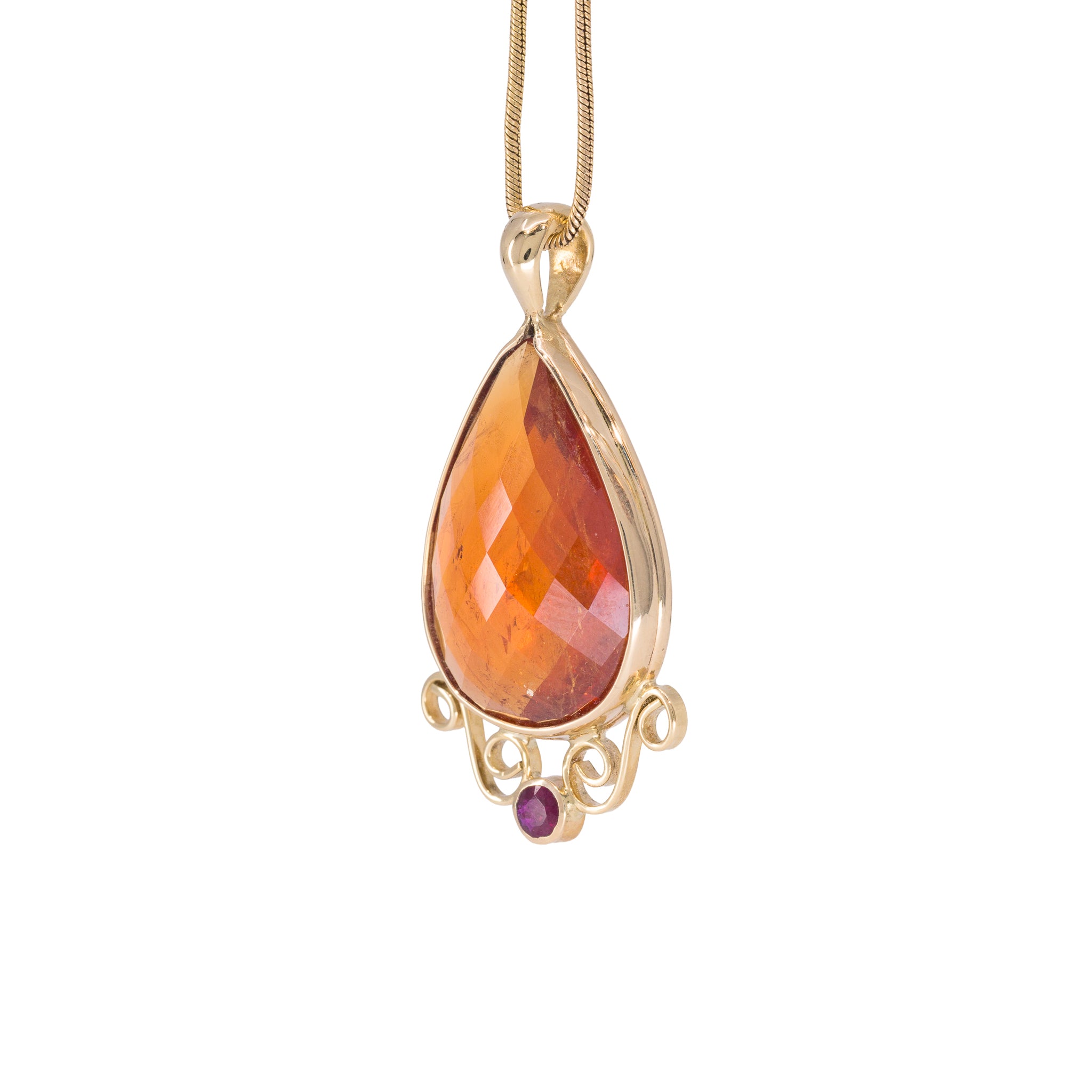 Spessartine Garnet and Ruby pendant handcrafted in 18K, angled view