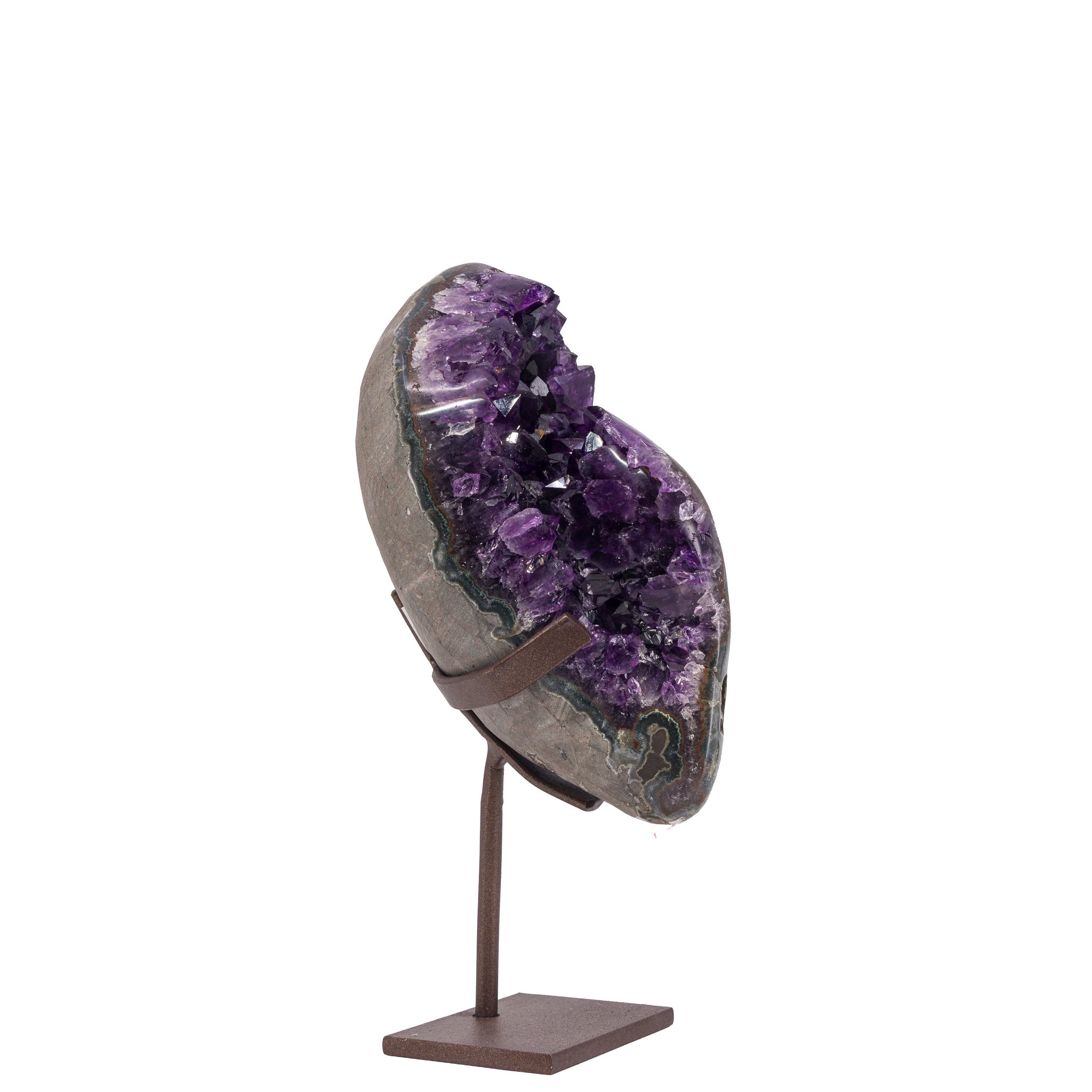 Sculptural Amethyst geode displayed on a bronze-tone metal stand, angled view
