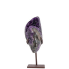 Sculptural Amethyst geode displayed on a bronze-tone metal stand, front view