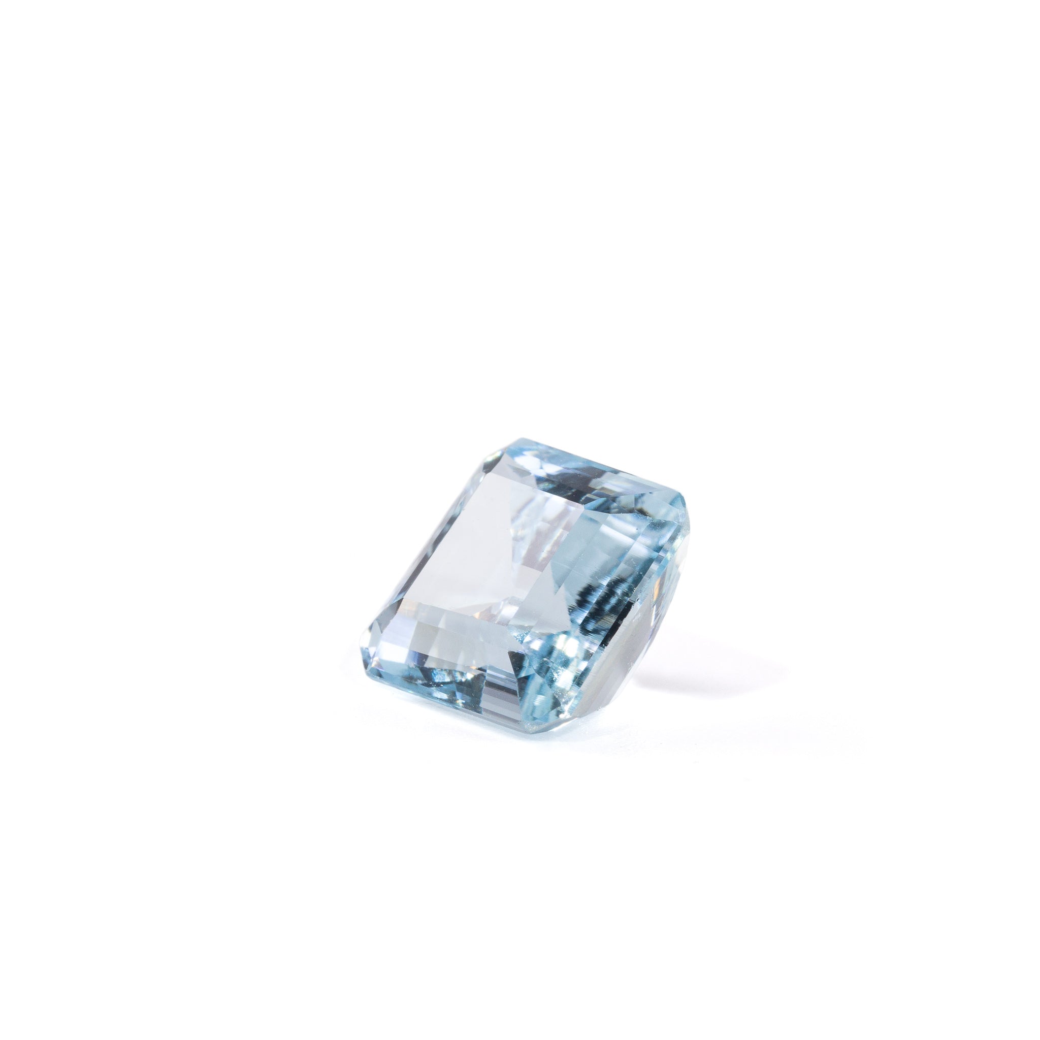 Square Aquamarine gemstone with clipped corners, angled view