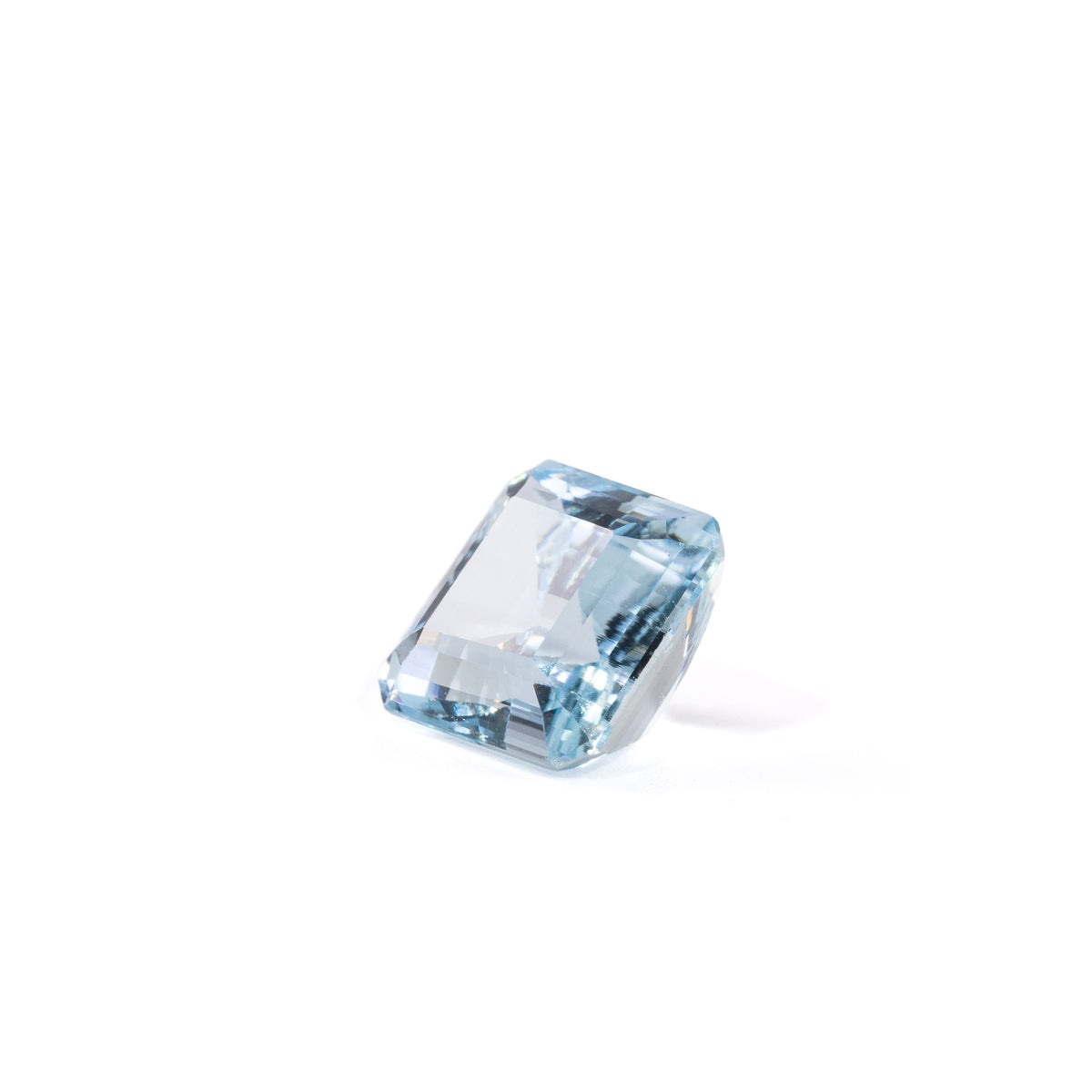 Square Aquamarine gemstone with clipped corners, angled view