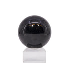 Second view of glossy Black Tourmaline sphere with natural markings