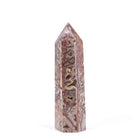Crazy Lace Agate tower with open crystal-lined cavities
