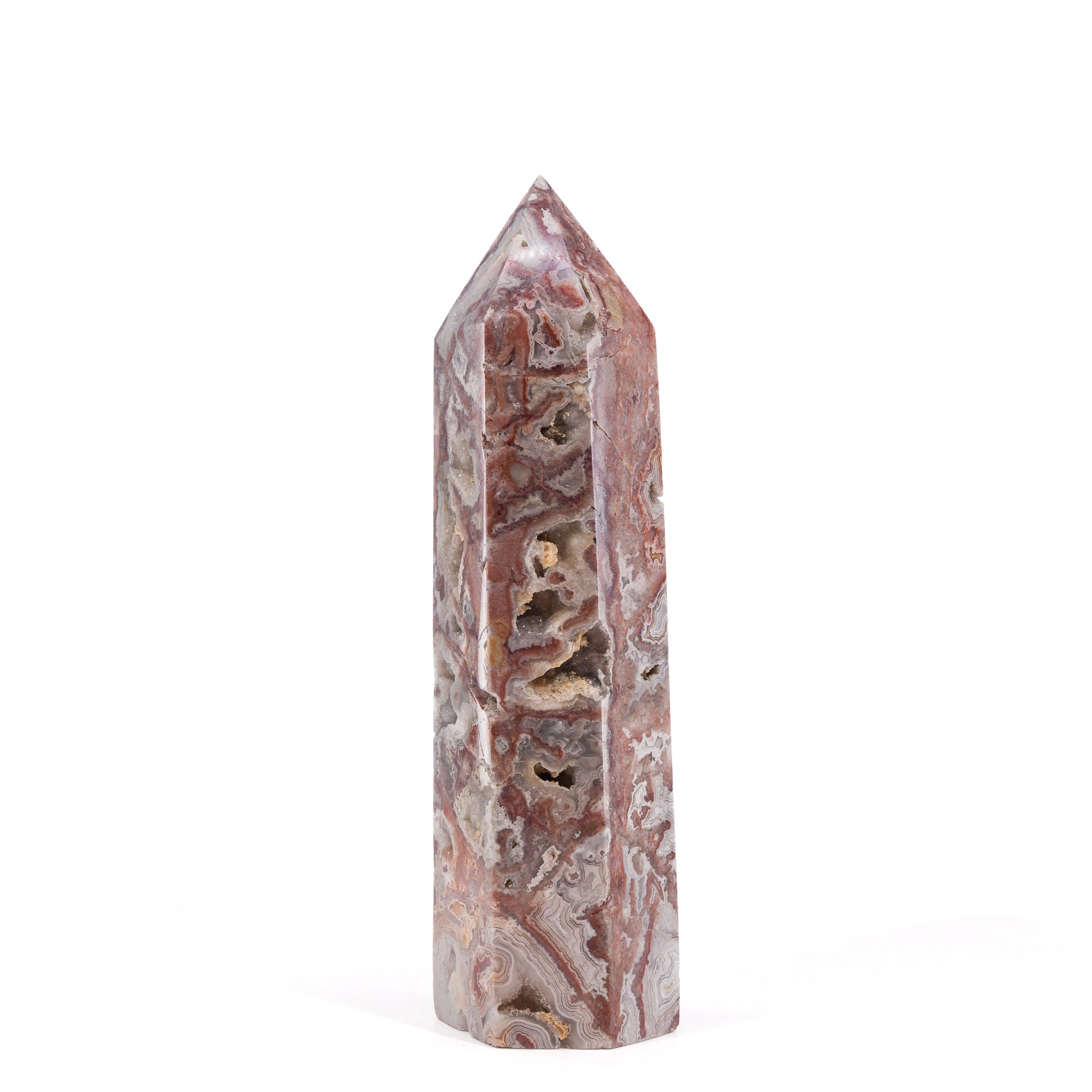 Crazy Lace Agate tower with open crystal-lined cavities