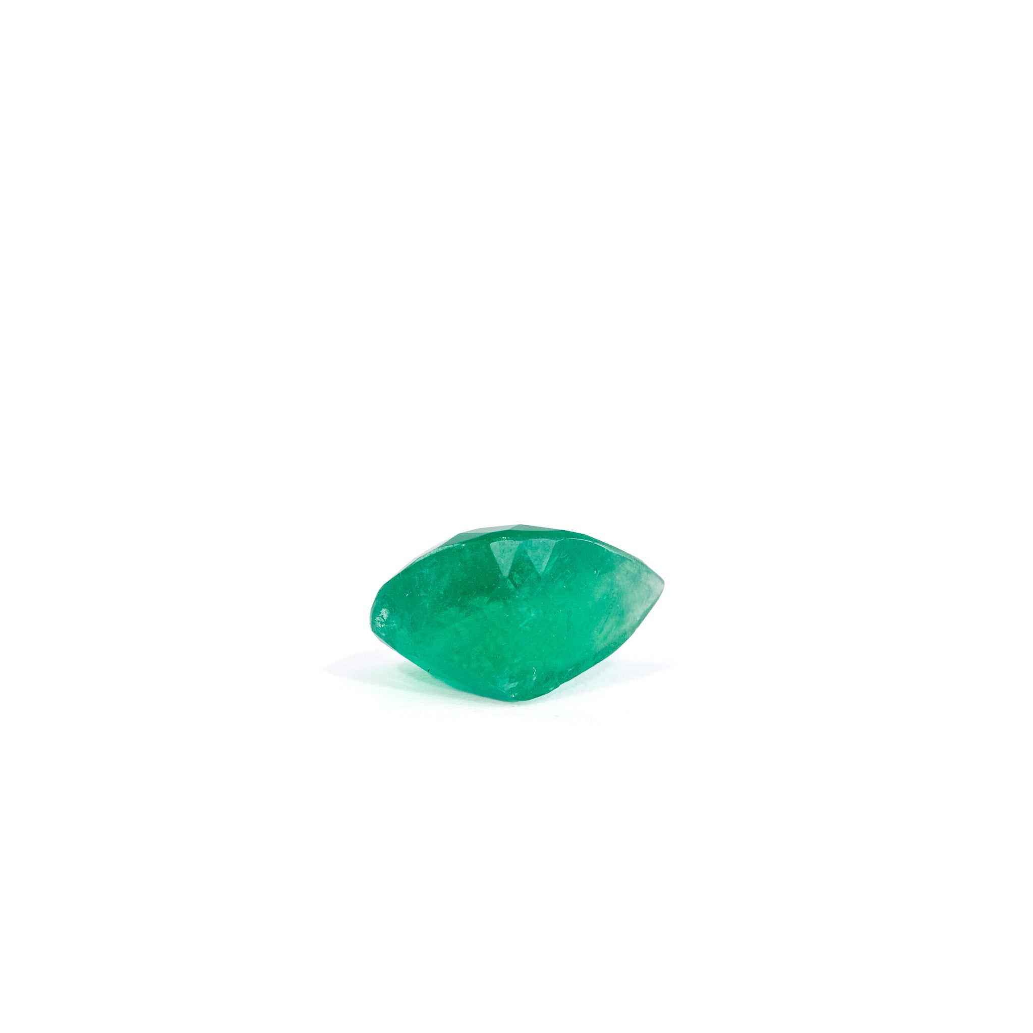 Side view of faceted Colombian Emerald showing its depth and green saturation