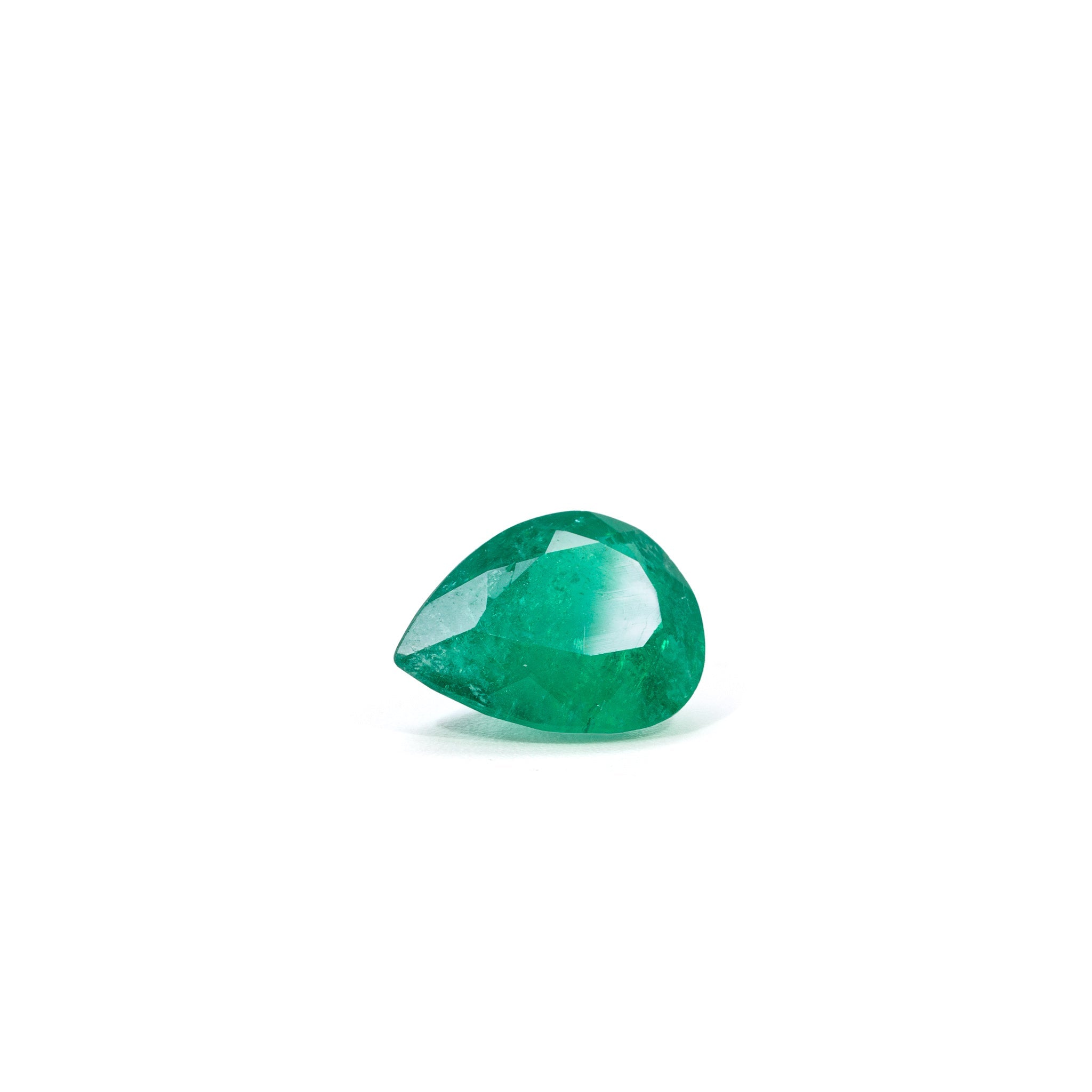 Front view of vivid green pear-cut Colombian Emerald gemstone