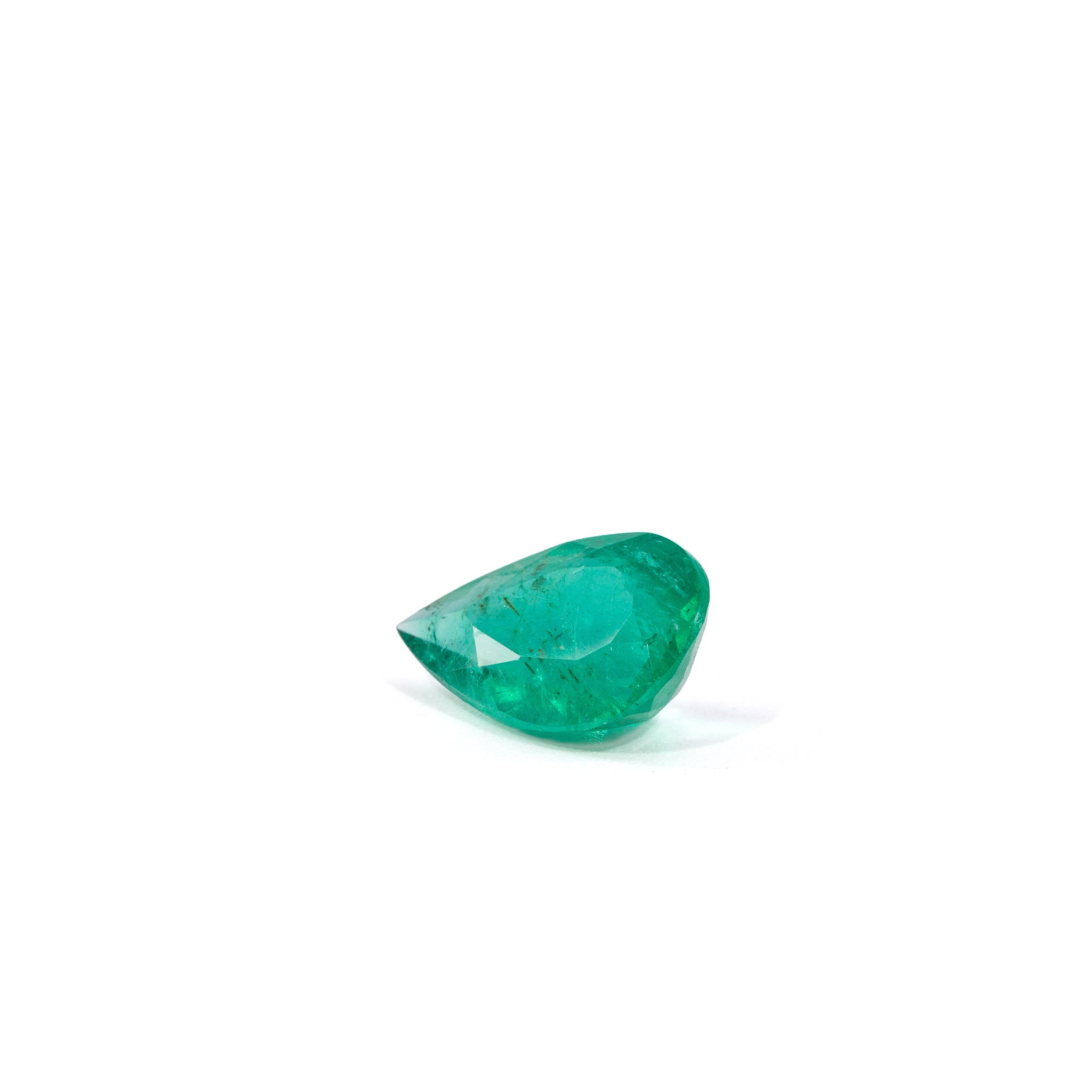 Angled view of Colombian Emerald showing dark natural inclusions