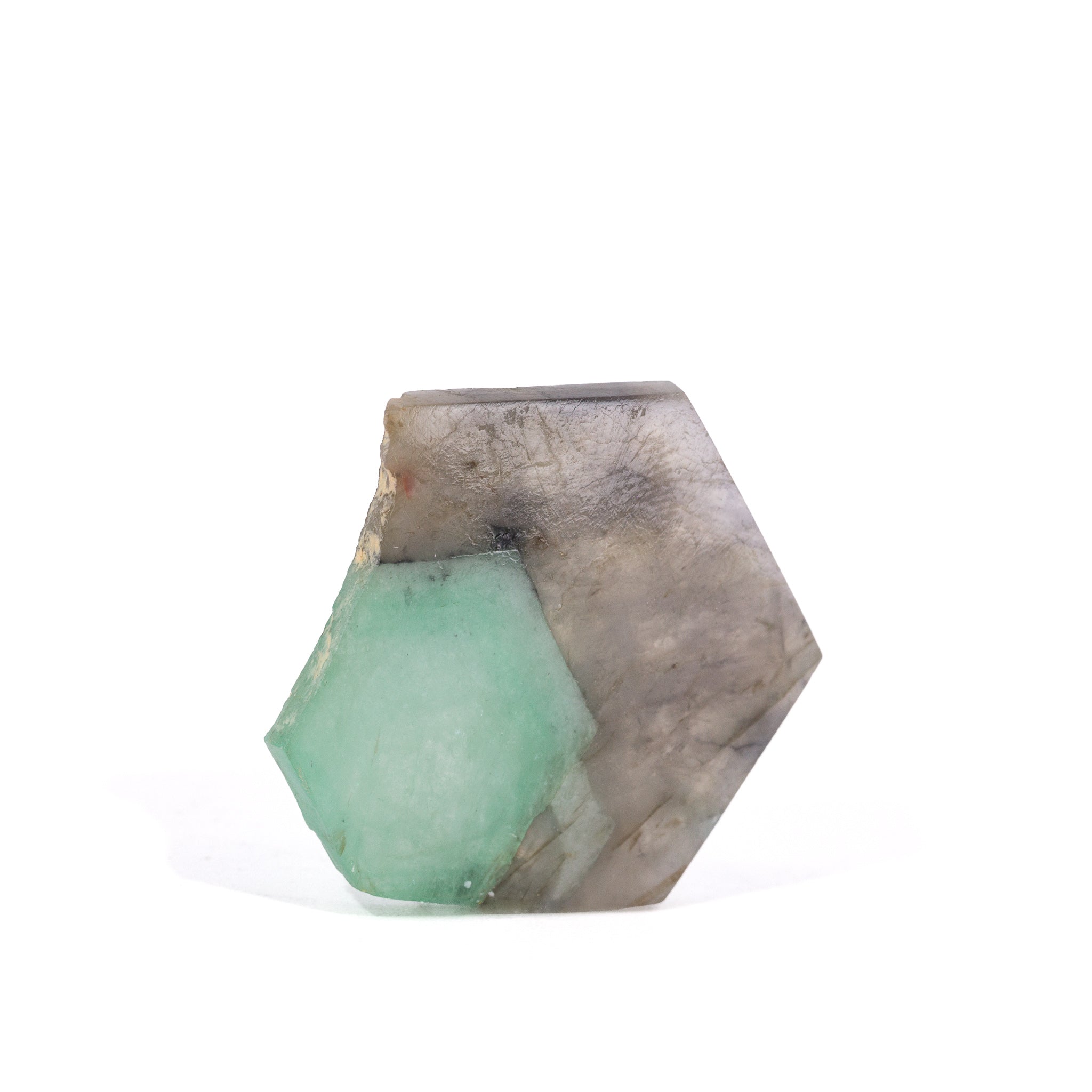 Reverse view of polished Smoky Quartz slice with embedded green Emerald crystal