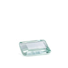 Angled face-up view of pale green step-cut Beryl with beveled corners