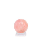 Blush-pink Morganite polished gemstone sphere, front view