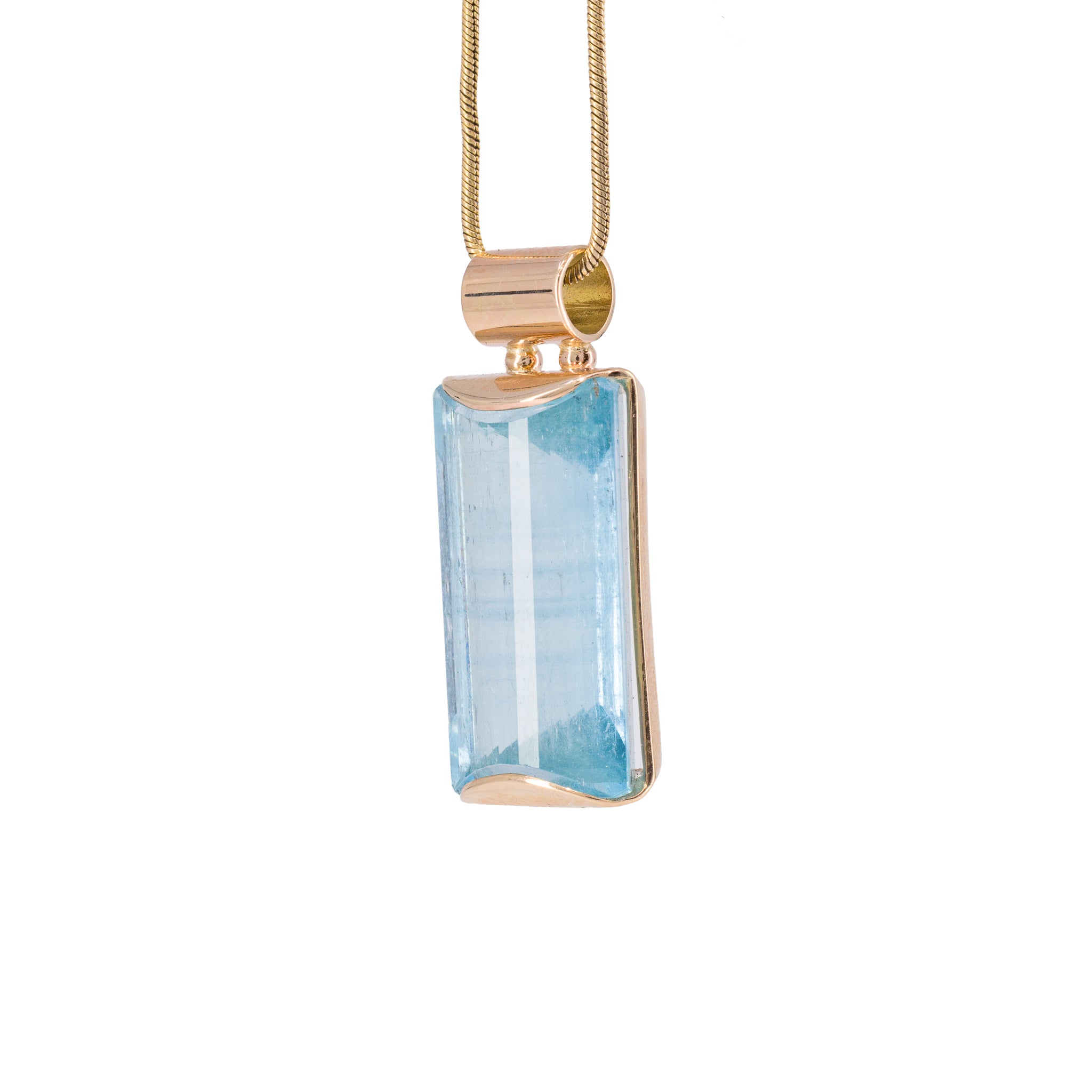 Side view of Natural Blue Topaz gemstone pendant in 14K