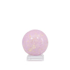 Side view of lilac Phosphosiderite sphere with scattered golden markings