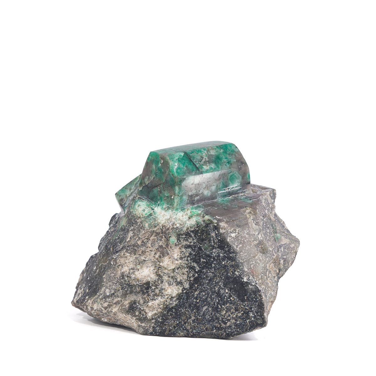 Angled view of polished Emerald faces and rugged matrix