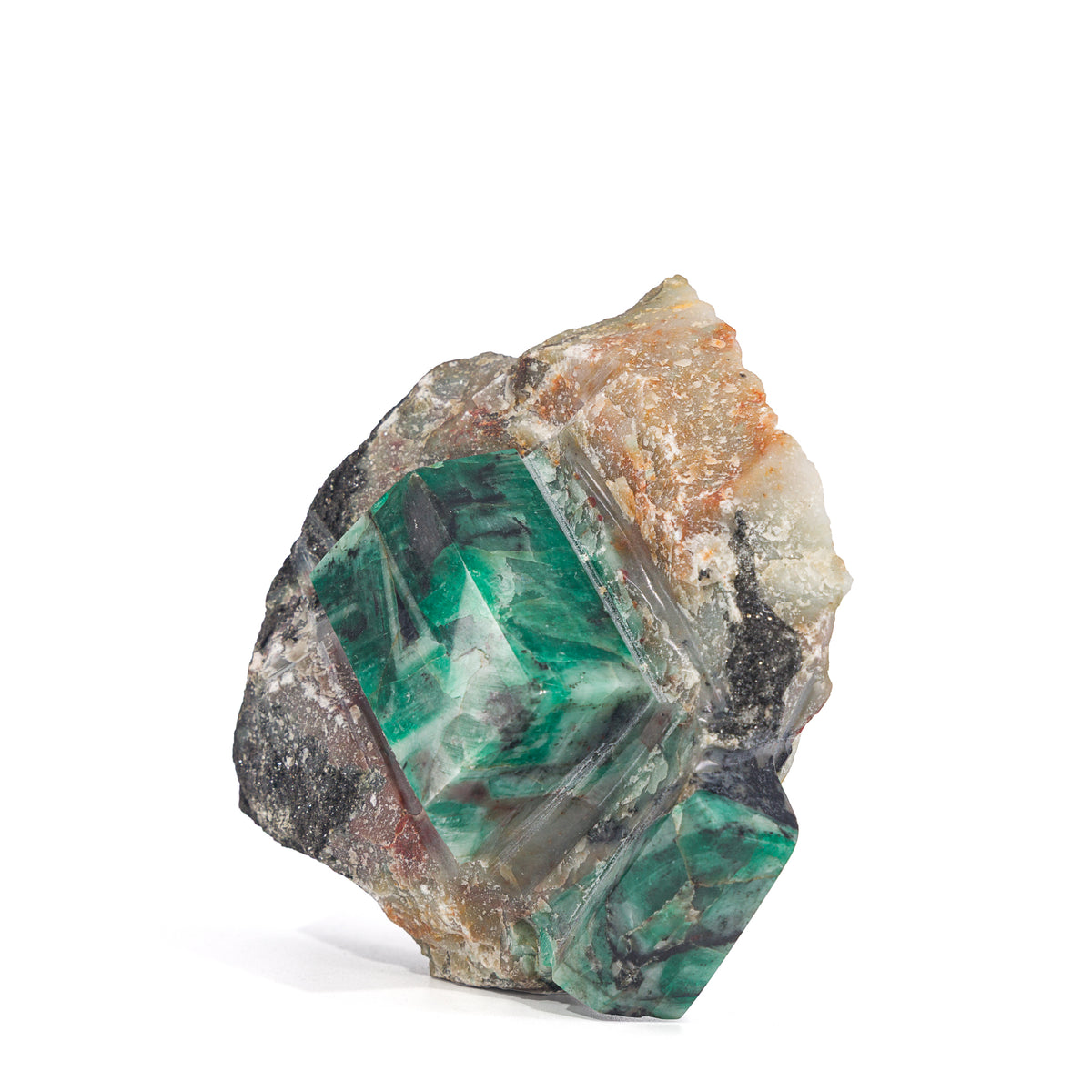 Angled view of polished green Emerald crystal and textured matrix
