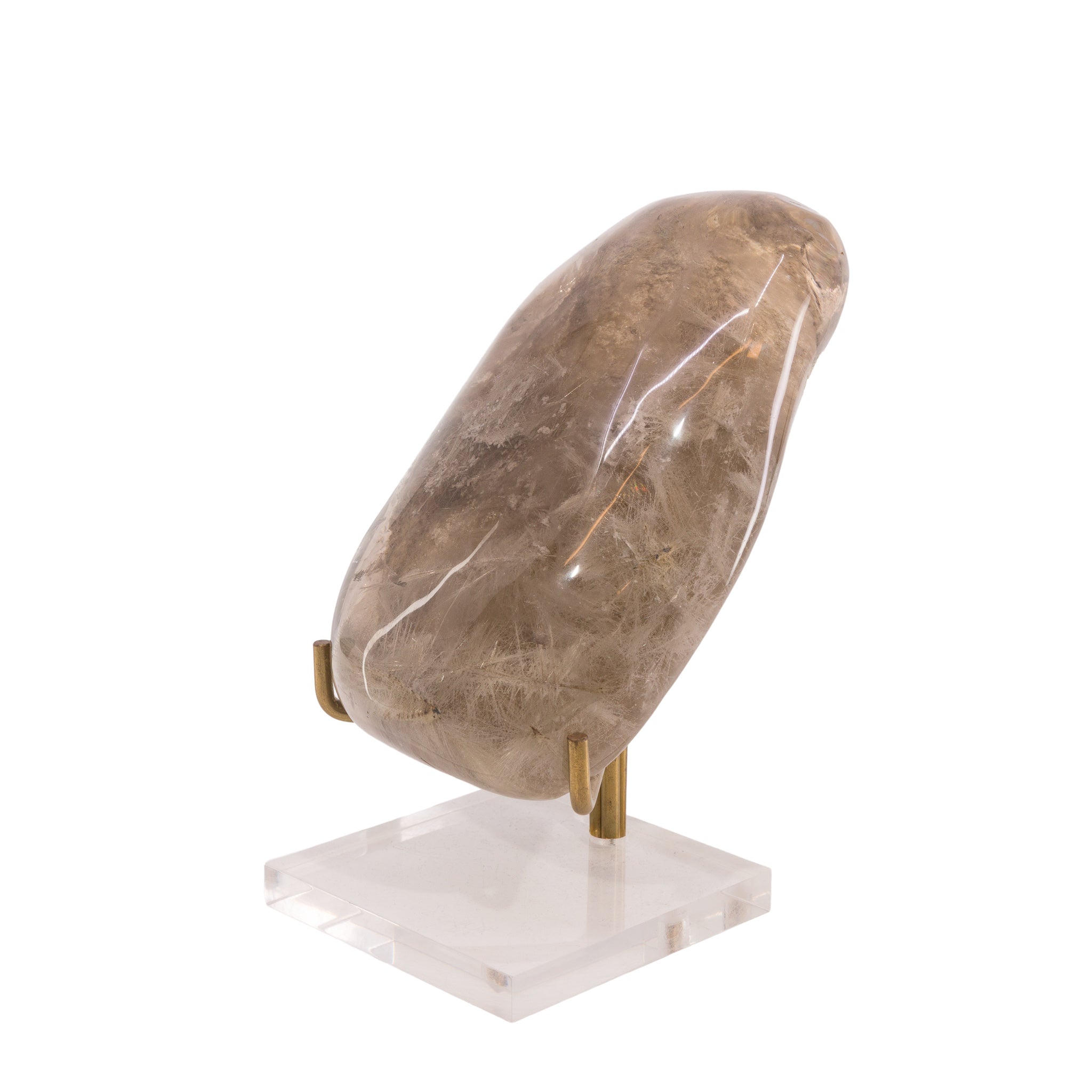 Opposite side of rounded Rutilated Quartz freeform photographed on a display stand