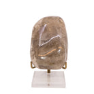 Front view of large smoky Rutilated Quartz freeform displayed upright on a stand