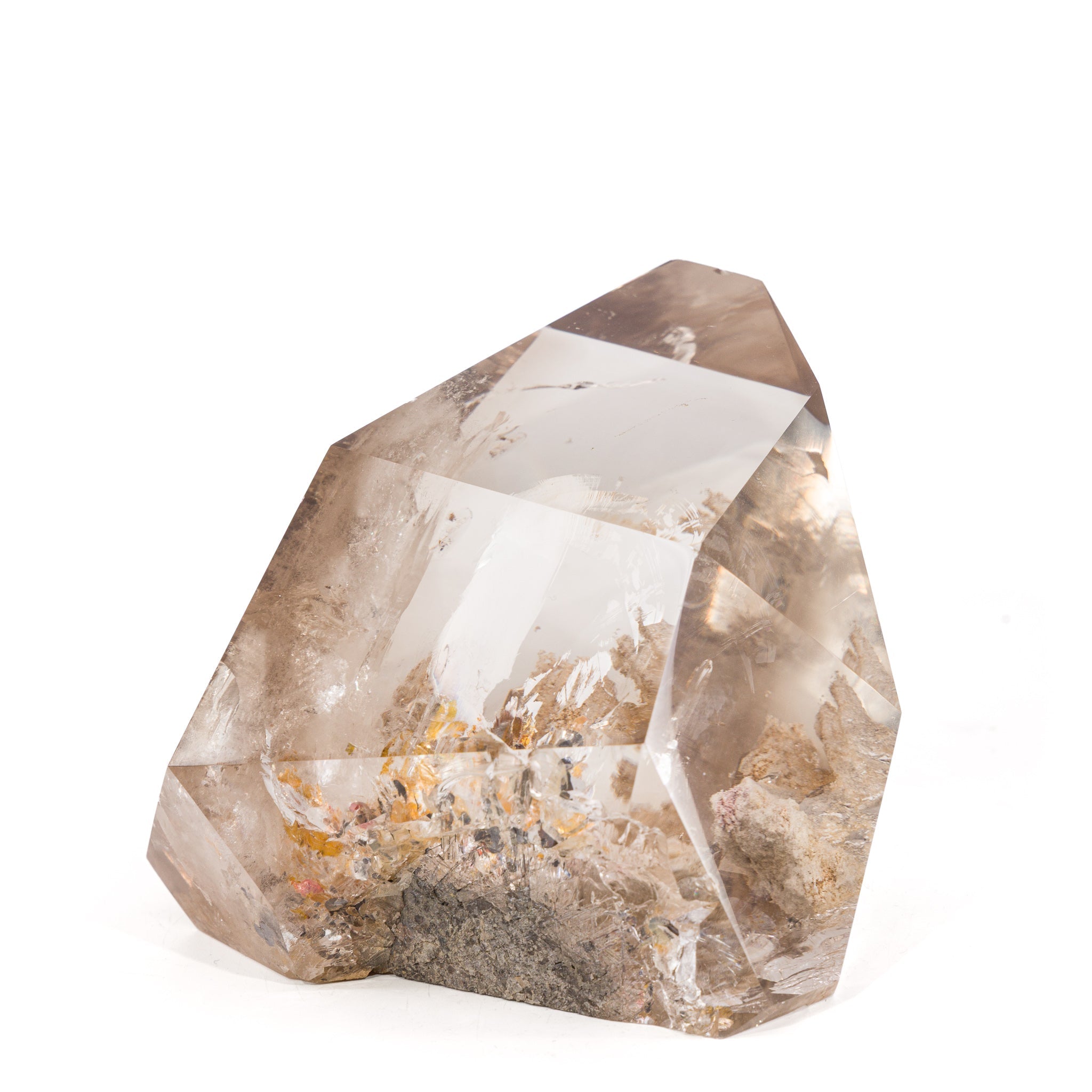 Angled view of Reticulated Rutilated Quartz point showing golden and dark mineral inclusions