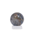 Sapphire sphere showing bronze-brown matrix and natural banding