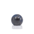 Sapphire sphere showing charcoal areas and blue banding