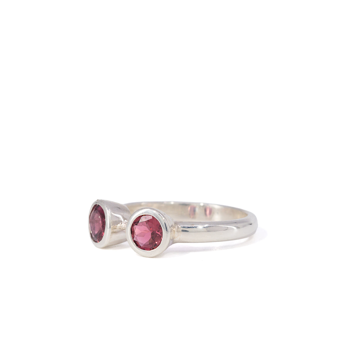 Side view of open Sterling Silver band and Garnet settings