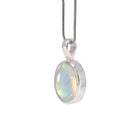 Angled view of Golden Moonstone charm pendant in Sterling Silver