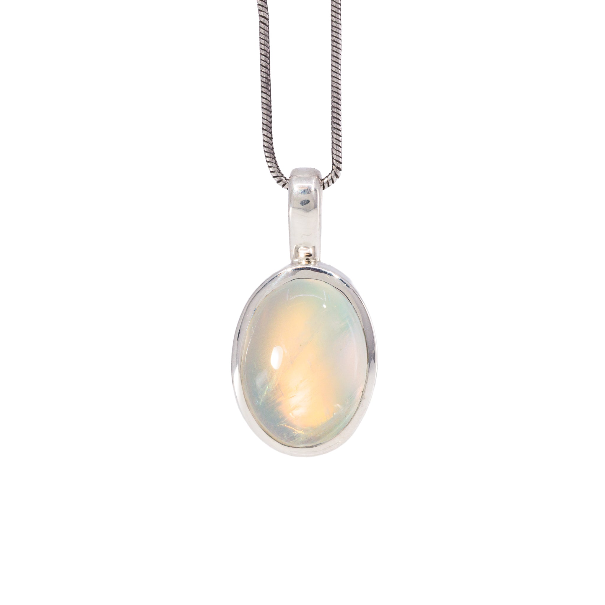 Golden Moonstone charm pendant in Sterling Silver with warm peach and yellow glow