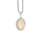 Golden Moonstone charm pendant in Sterling Silver with warm peach and yellow glow