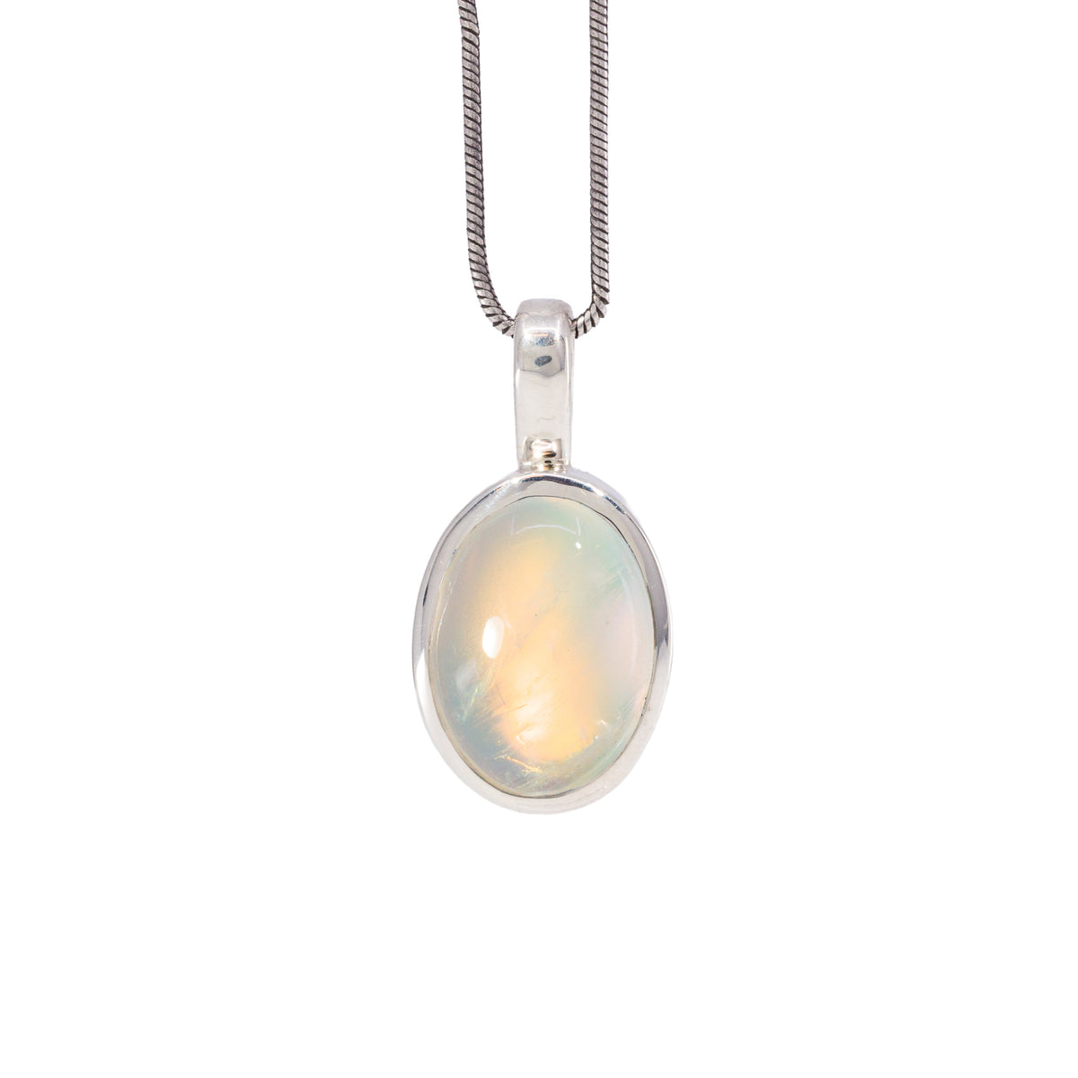 Golden Moonstone charm pendant in Sterling Silver with warm peach and yellow glow