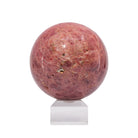 Alternate view of pink Spinel sphere showing natural matrix and cavities