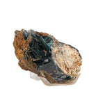 Vivianite crystals emerging from textured matrix